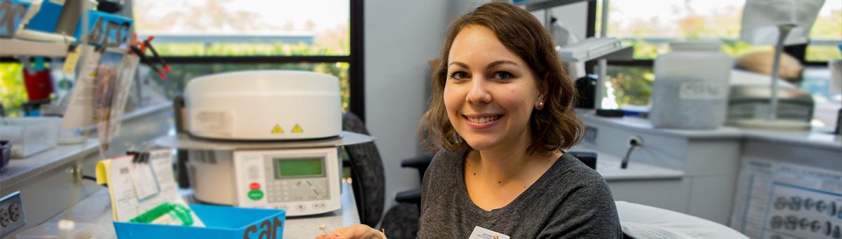 Two lab tech students work together on some data entry in a Pima lab